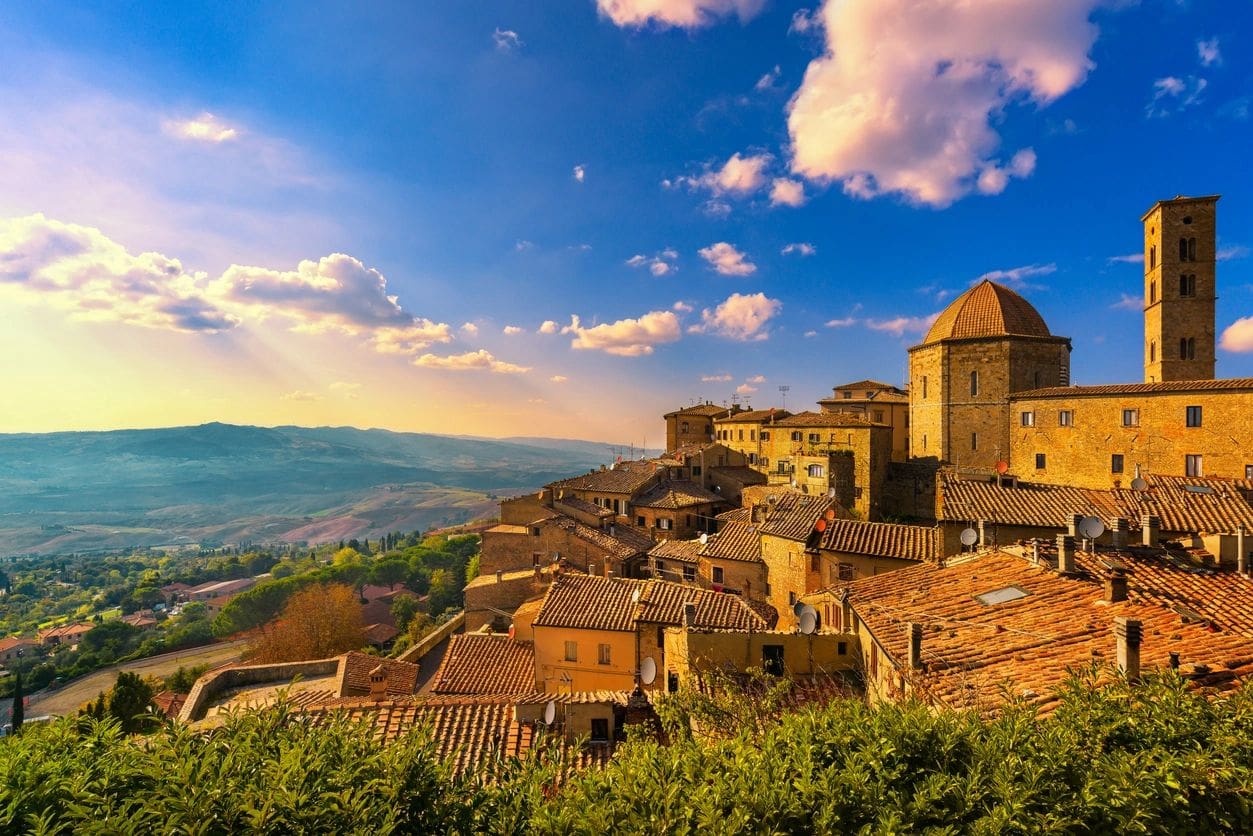 A view of some buildings on top of a hill.